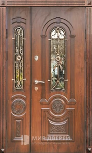 Уличная дверь со стеклом и ковкой №78 внешняя - фото